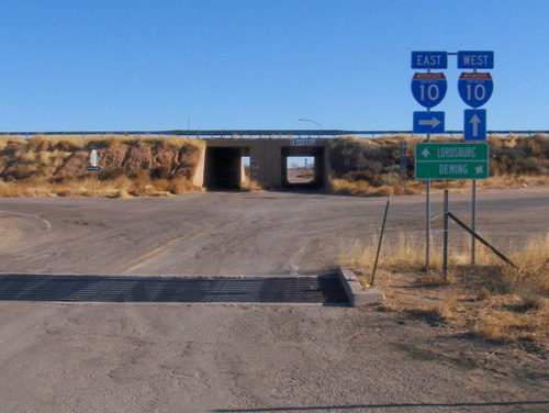 Old underpass; modern trucks and trailers barely fit through.